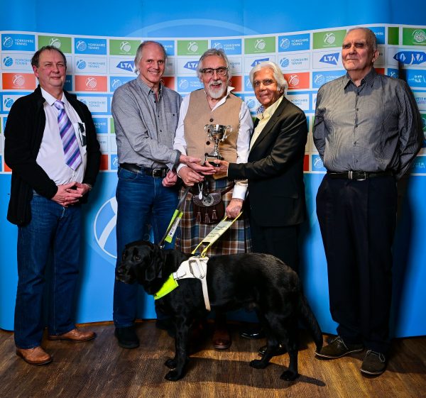 People holding trophy