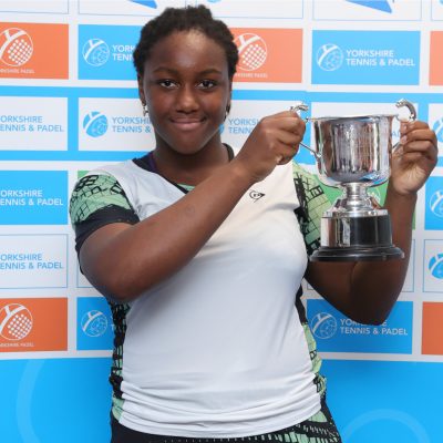Girl holding trophy